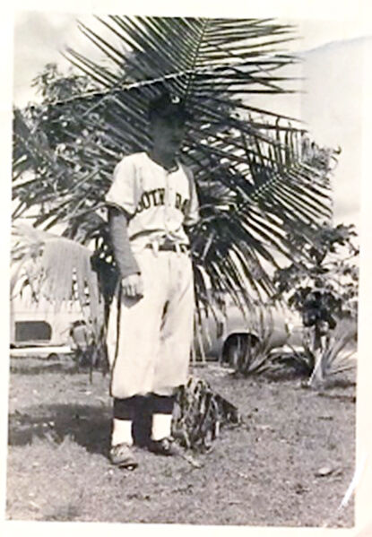 Mr. William “Bill” Squiers, in photo taken at his home, in his South Dade High School baseball uniform.